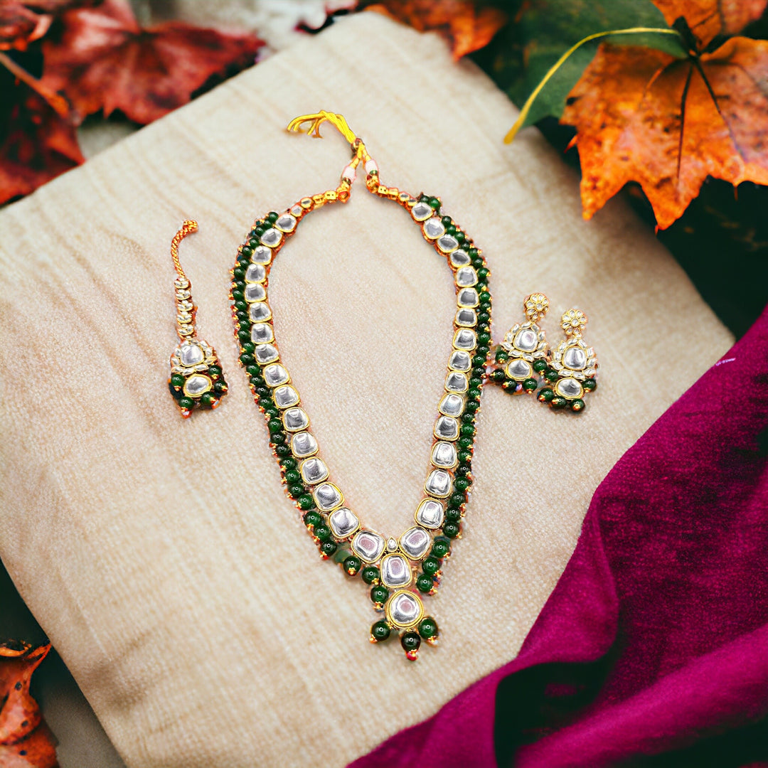 Exquisite Kundan Jewellery Set with Dark Green Beads, Earrings, and Maang Tikka