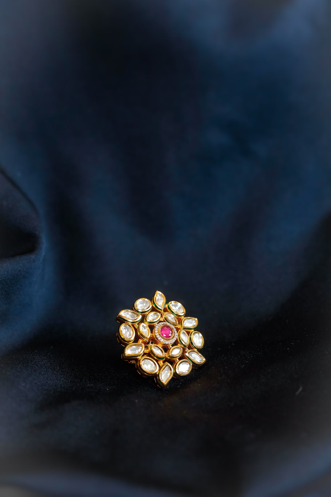 Kundan adjustable finger ring with red stone in center